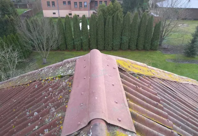 Installation of bitumen corrugated sheet roofs